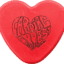 Heart-shaped disc golf disc with "Atomic Heart" logo design. Perfect for disc golf enthusiasts and c.