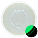 Glow plastic disc golf distance driver with wave design and bright green glow for night play.