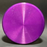 Purple disc golf disc with a metallic finish and small glitter details.